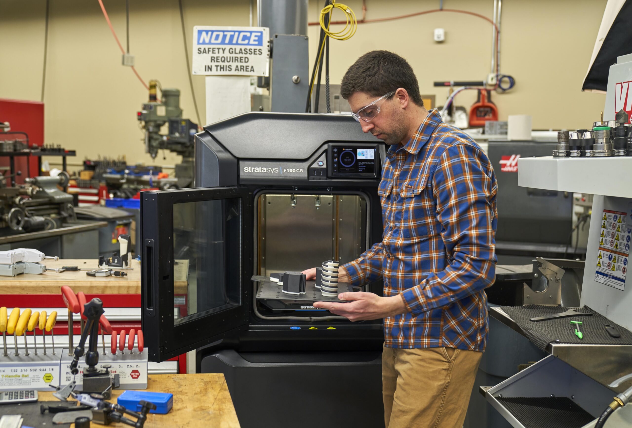 Haas CNC mill in job shop with Stratasys FDM 3D printer